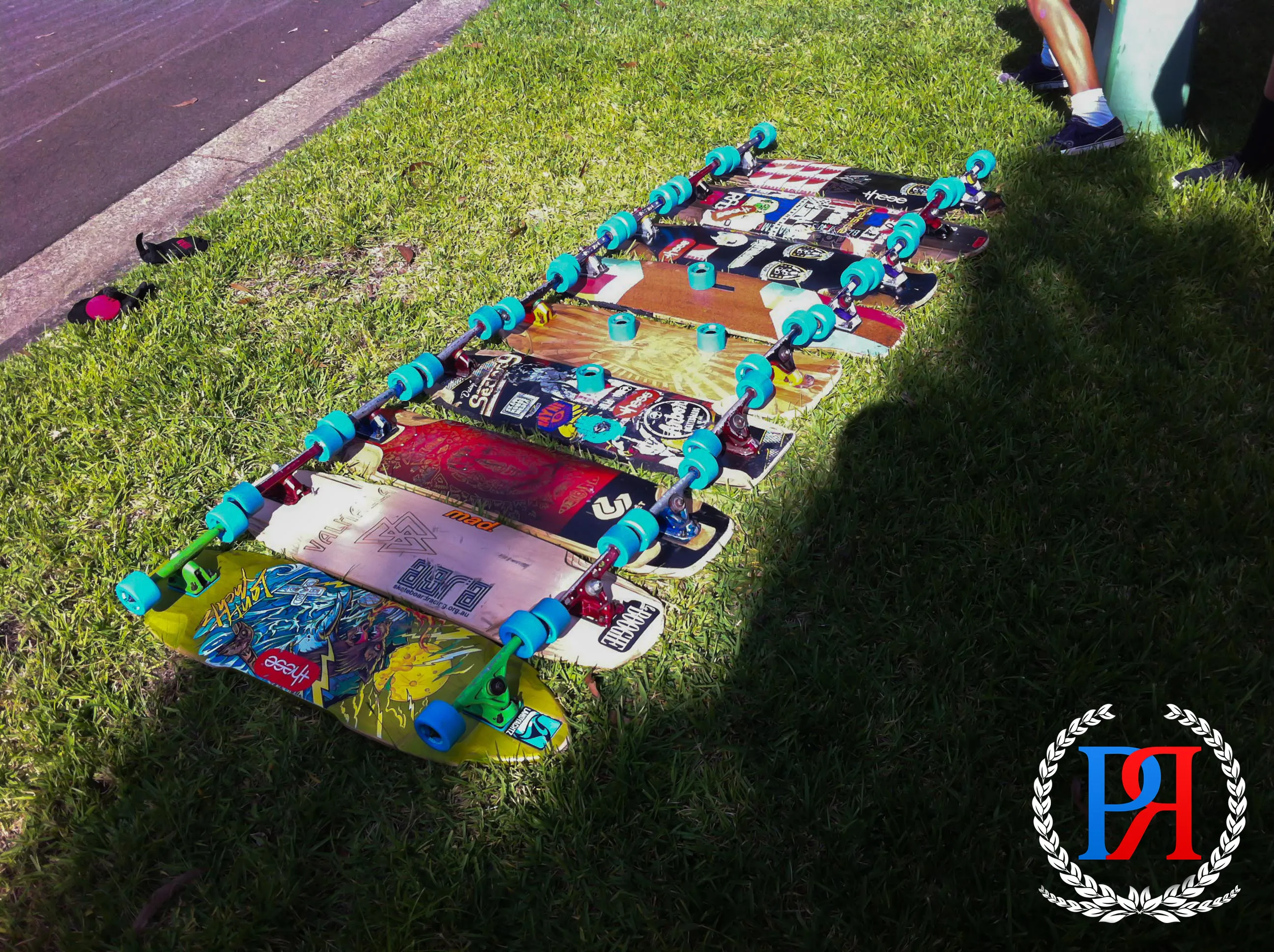 A pair of Premier Wheel Co longboards laid out — lifestyle context shot from the brand archive.