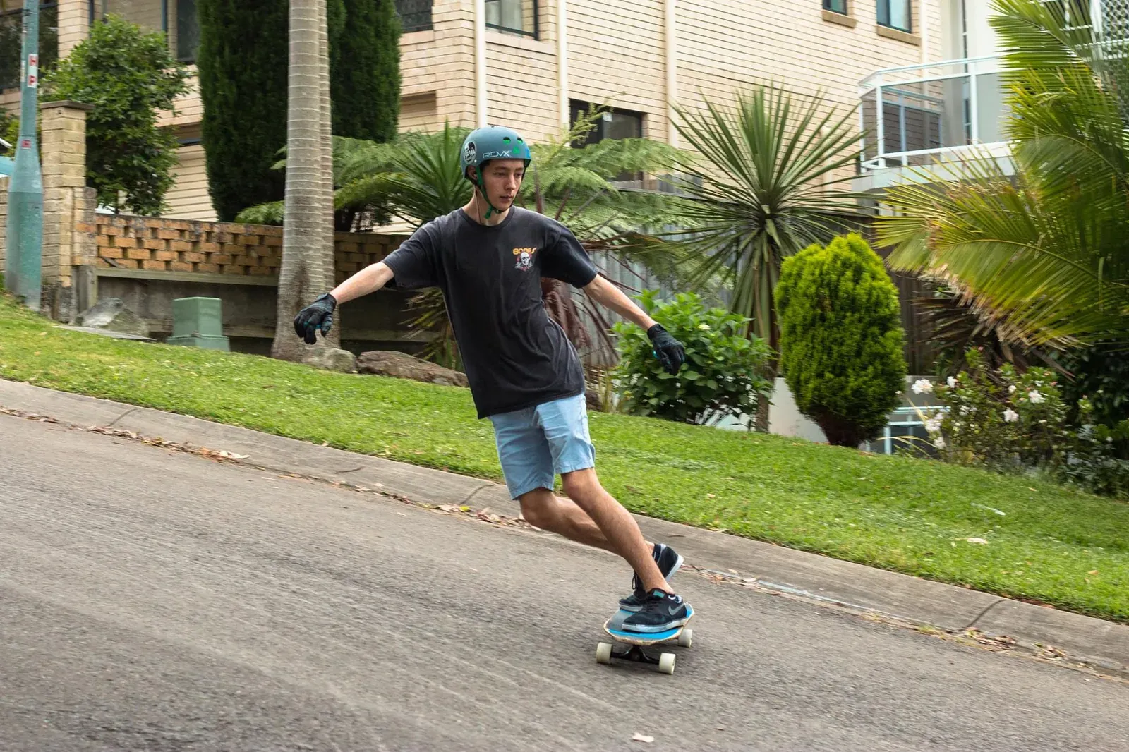 Longboard rider on a Sydney street.